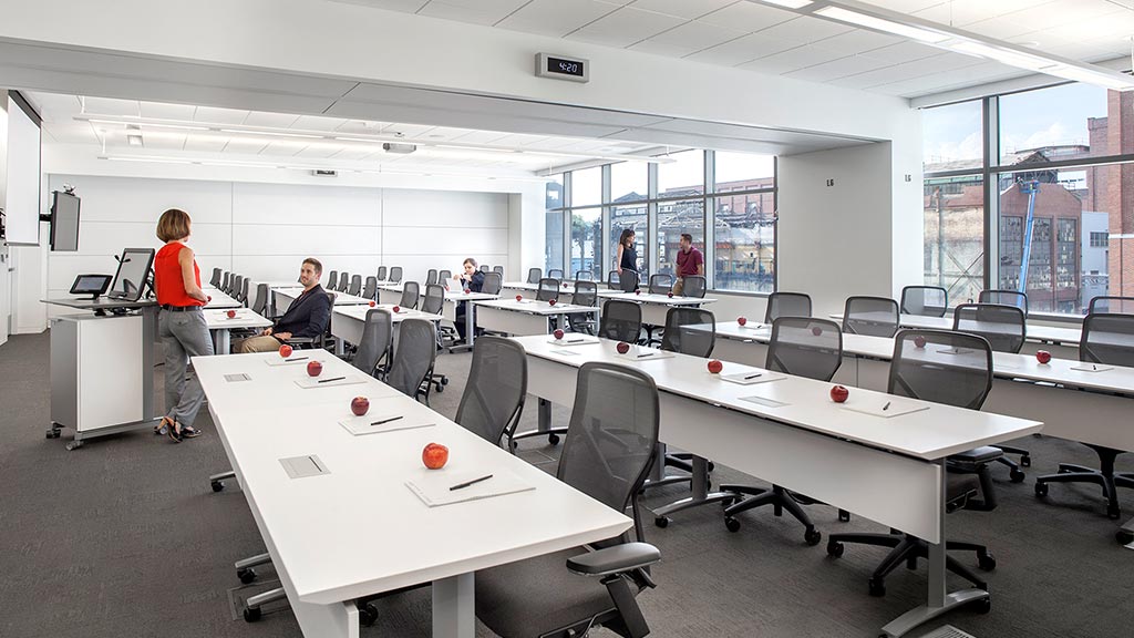 A room with tables and chairs.