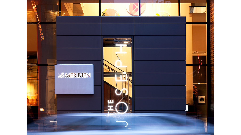 A building with windows and a sign.