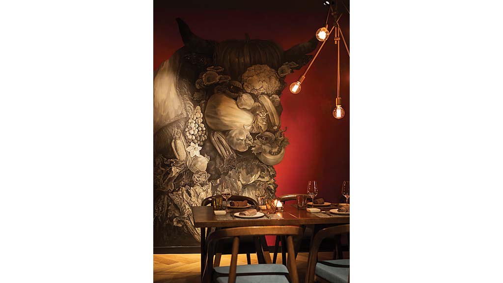 A table with a statue of a bear on it.