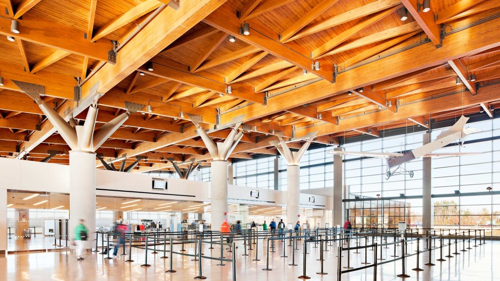 A large room with a large glass ceiling and a large white pillar.