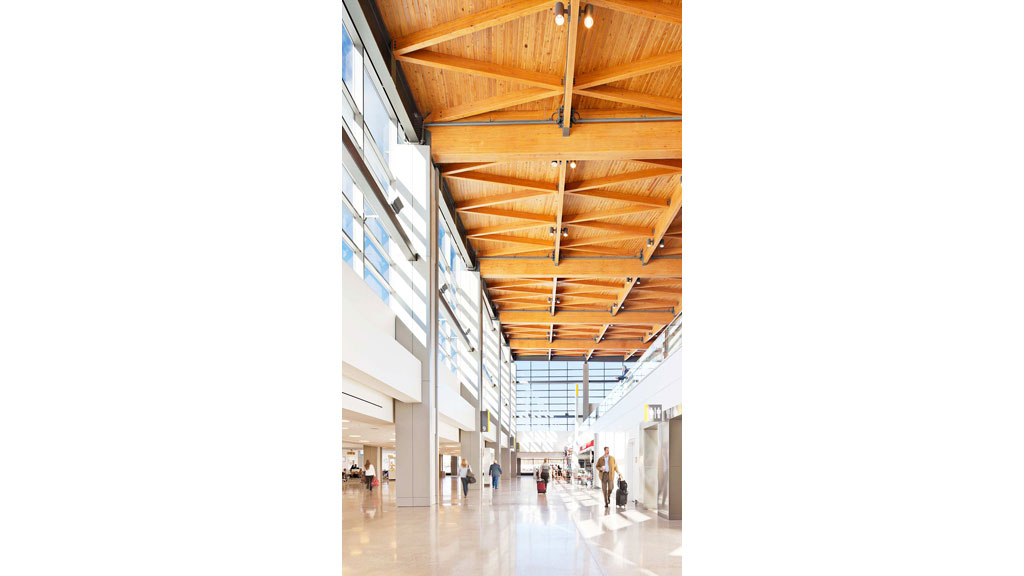 A group of people walking in a large building.