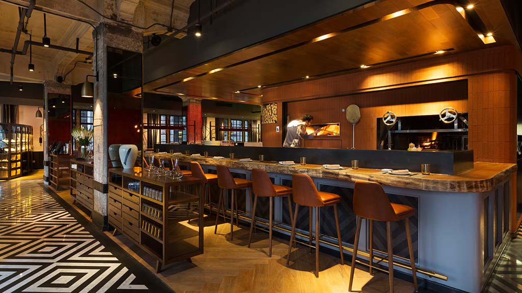 A bar with stools and a bar.