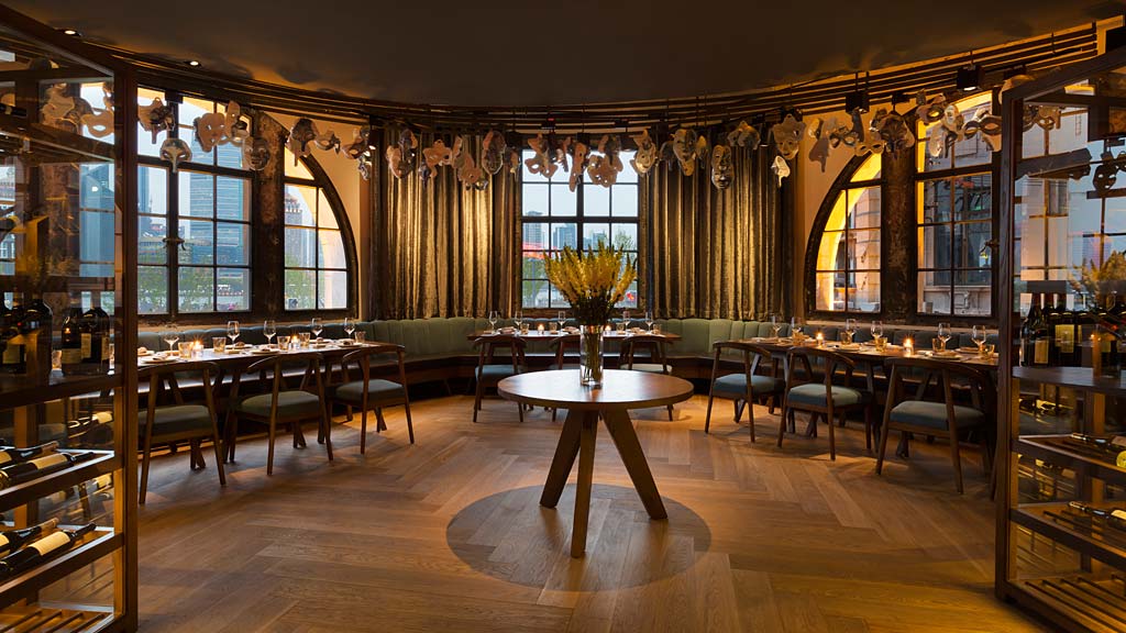 A large room with tables and chairs.