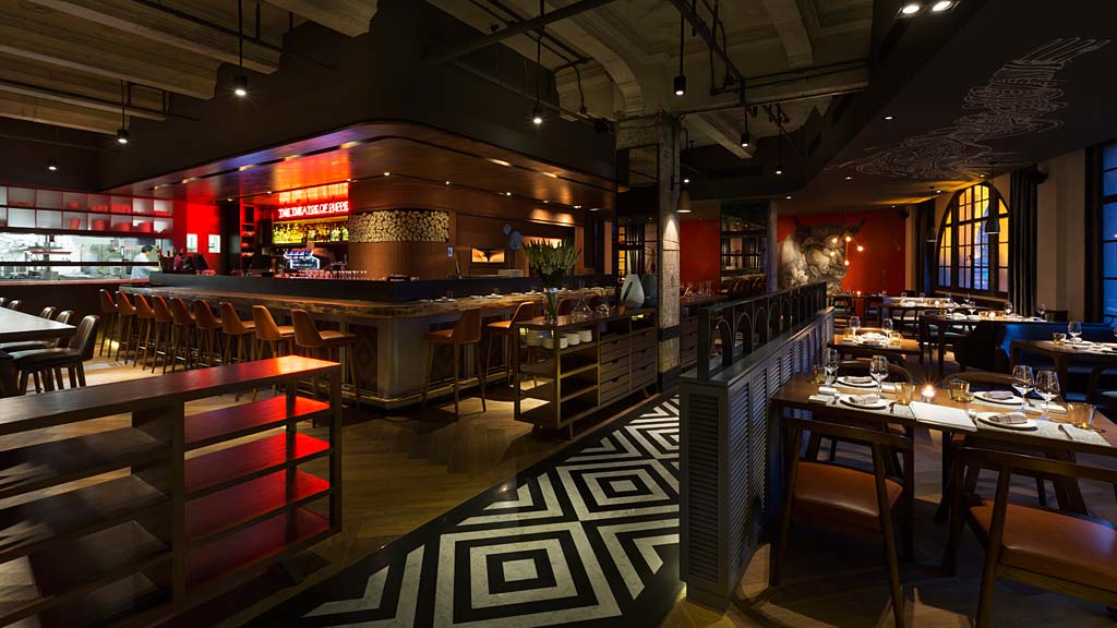 A restaurant with tables and chairs.