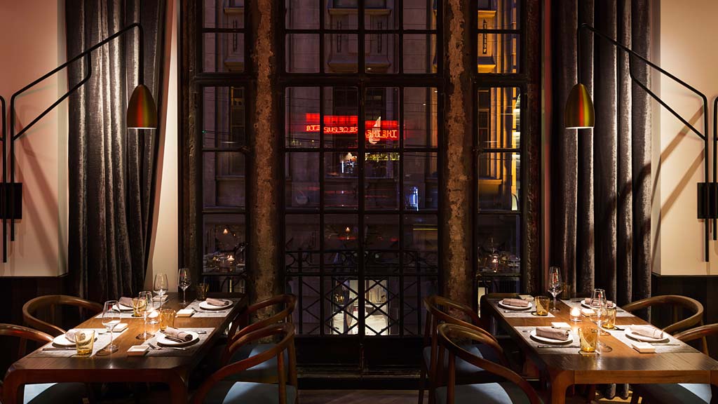 A dining room with a large glass door.