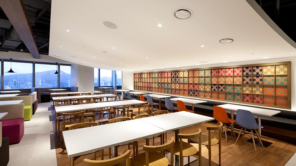 A room with tables and chairs.