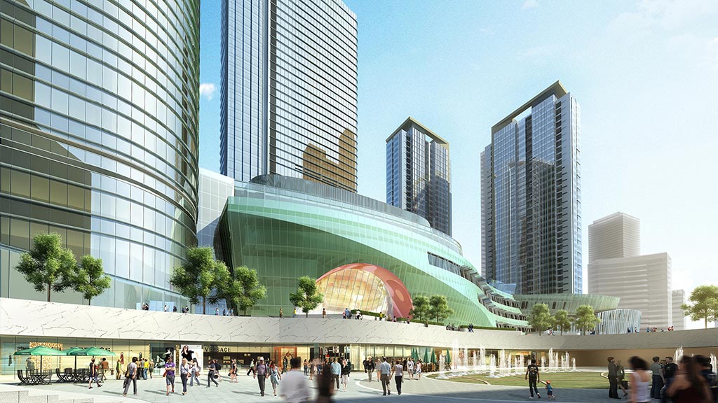 A group of people walking around a large building.