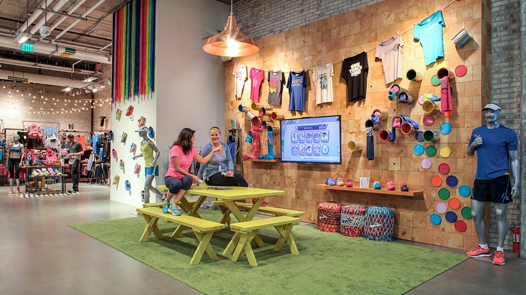 People in a room with tables and chairs.