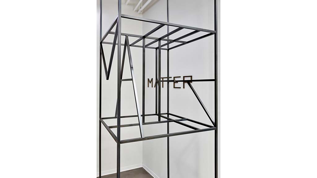 A white wall with a black and white design.