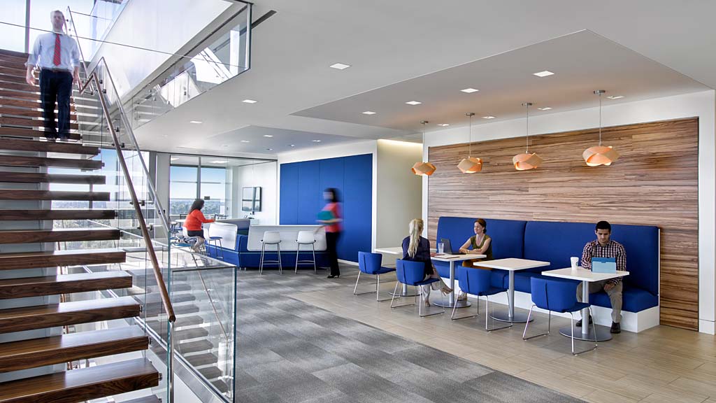 A group of people sitting at tables.