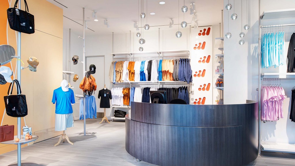 A person looking at a display of clothing.