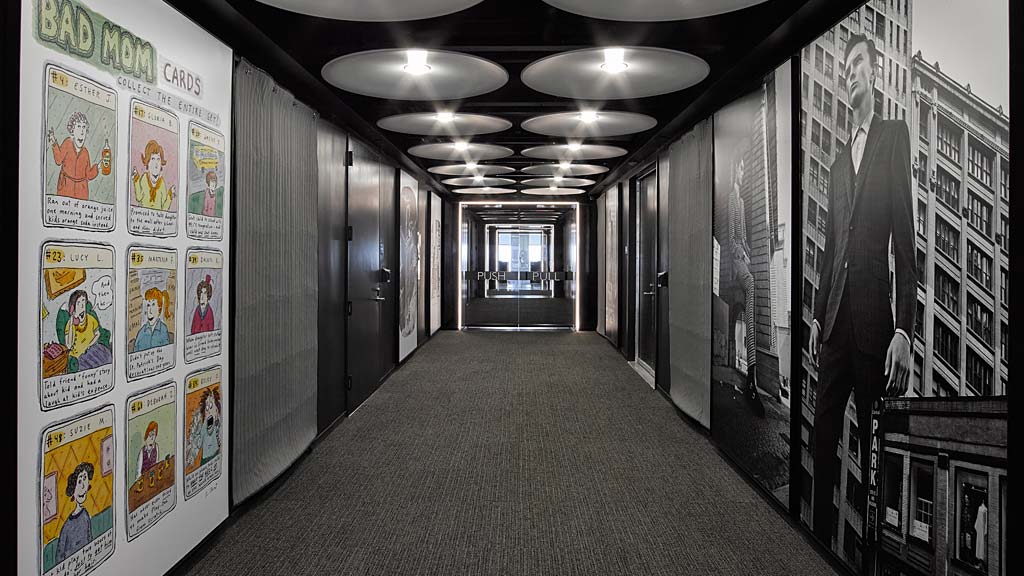 A hallway with a few lights.