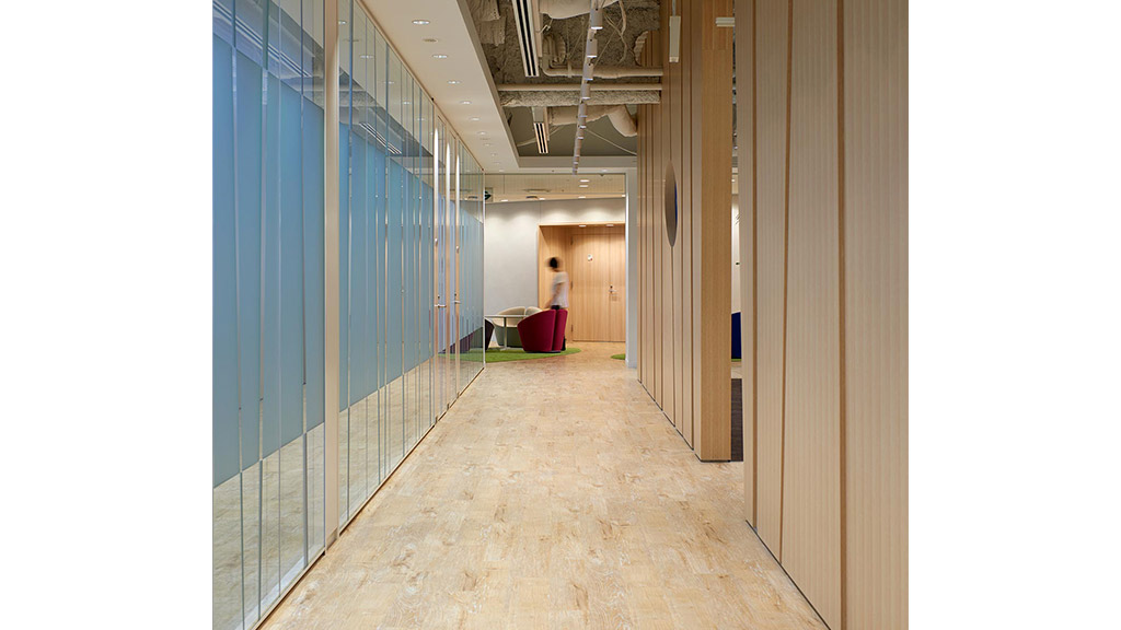 A person standing in a hallway.