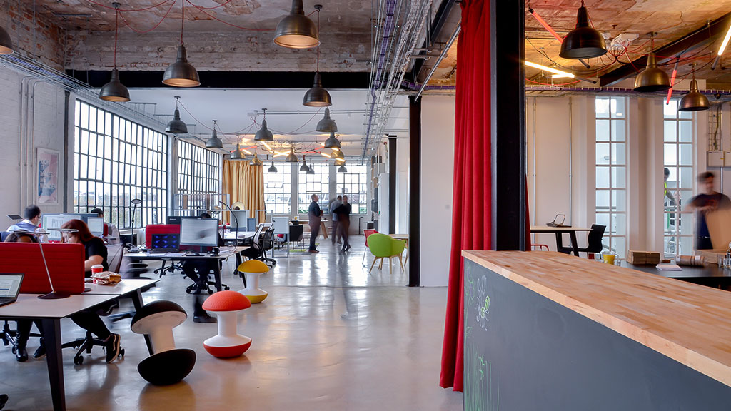 A large room with tables and chairs.