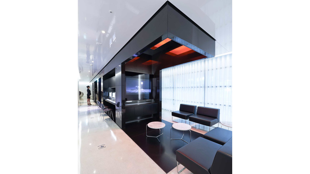 A room with a tv and couches.