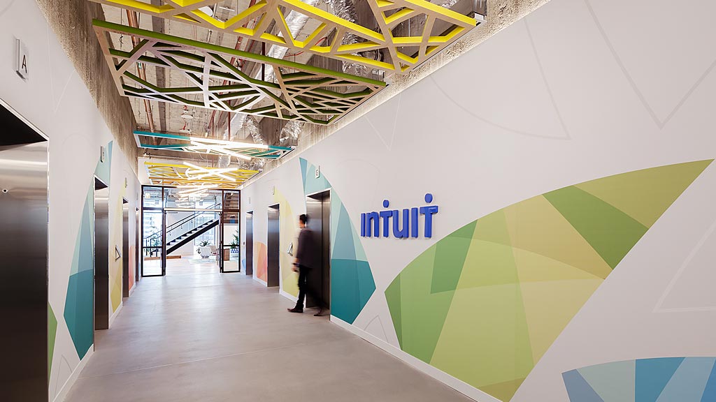 A person walking in a hallway.