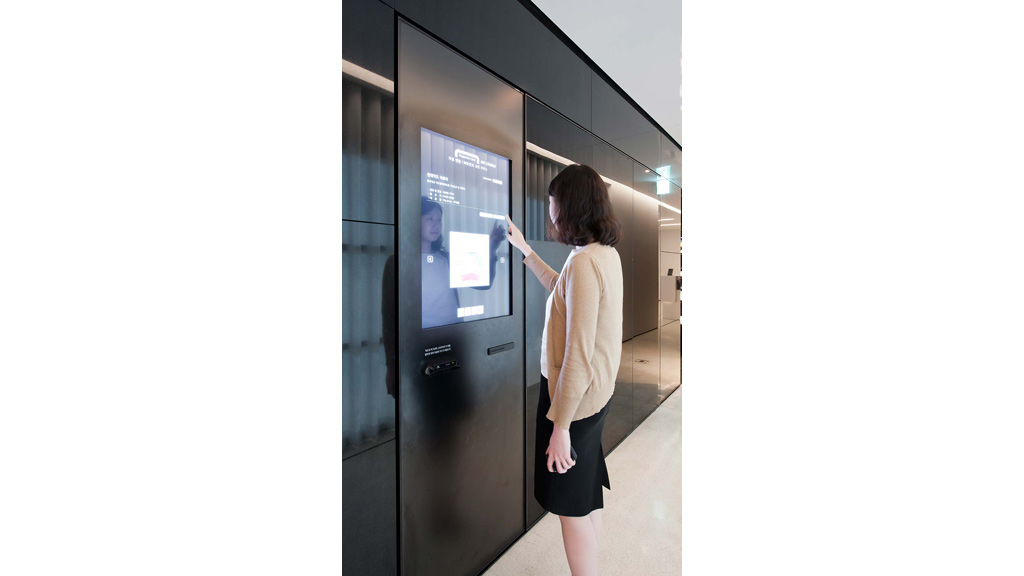 A woman looking at a screen.