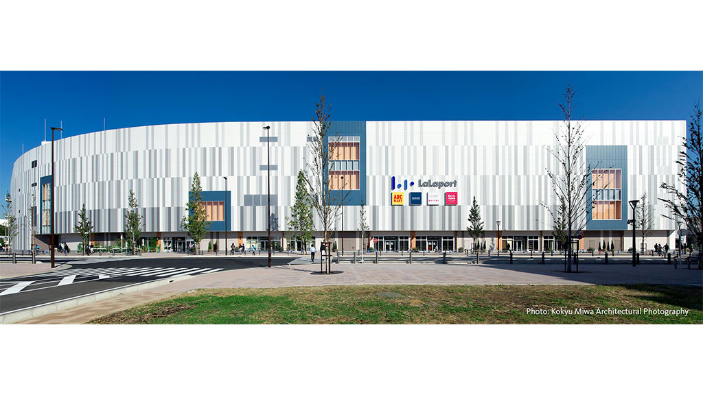 A large building with trees in front of it.