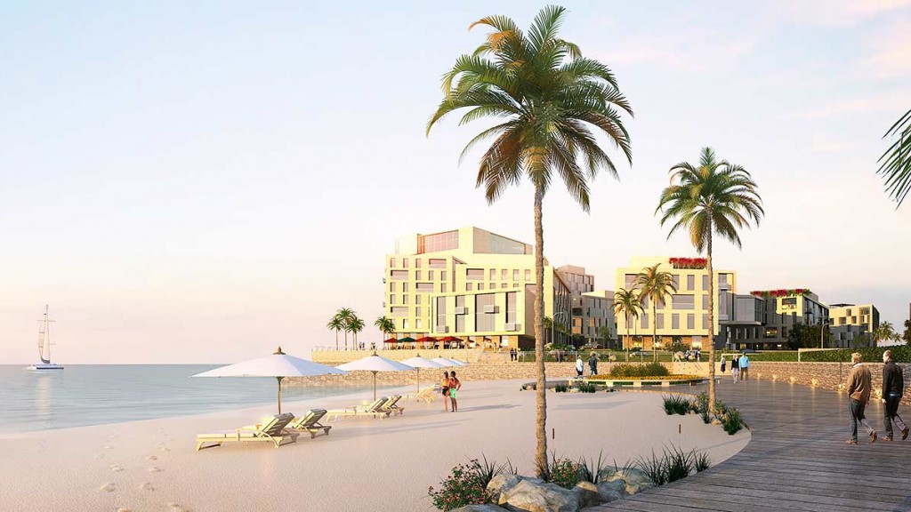 A group of people walking along a waterfront.