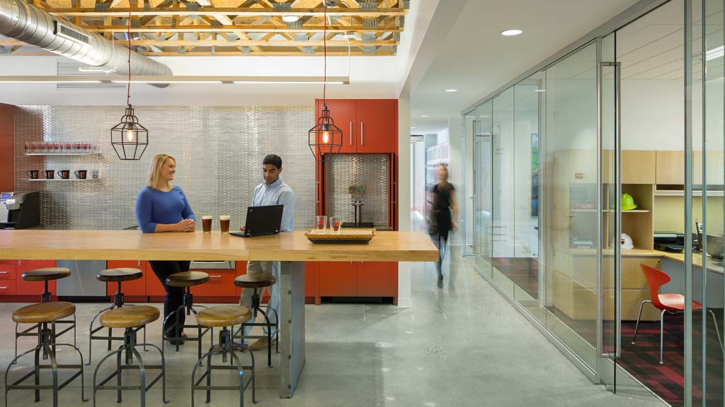 A few people working at a table.