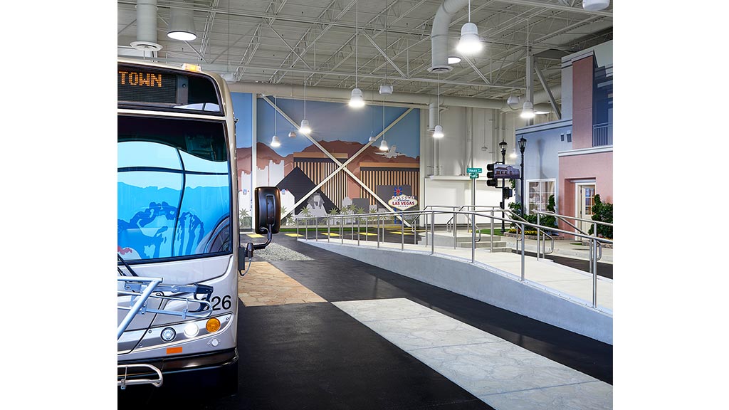 A bus parked in a garage.