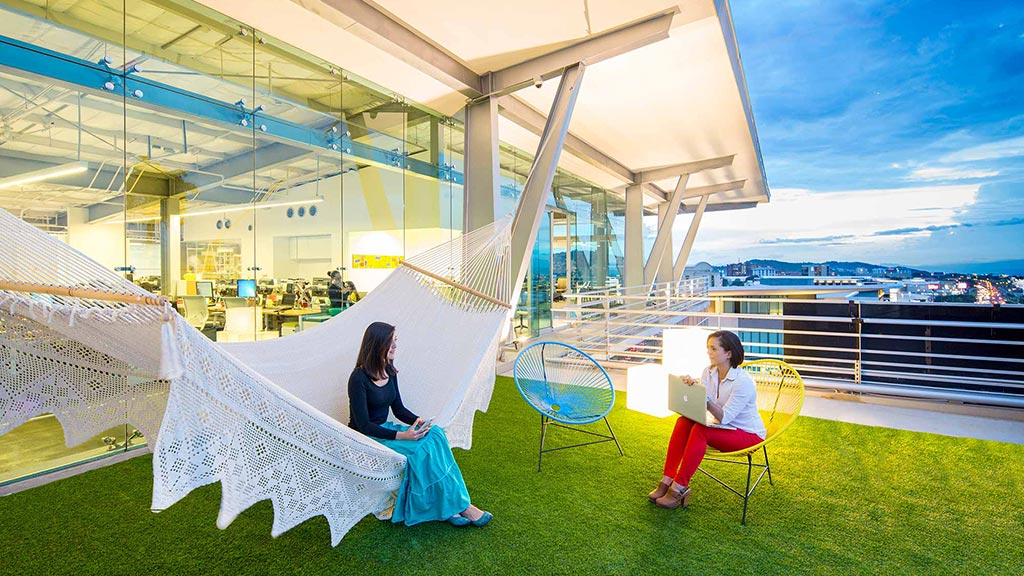 A man and woman sitting in chairs.
