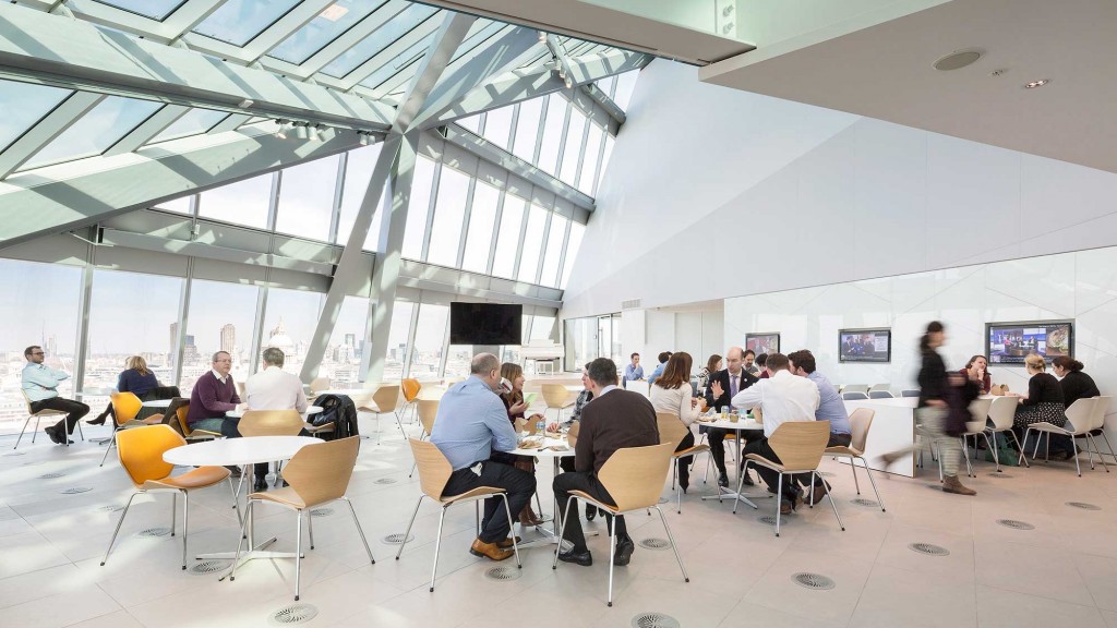 A group of people sitting at tables.