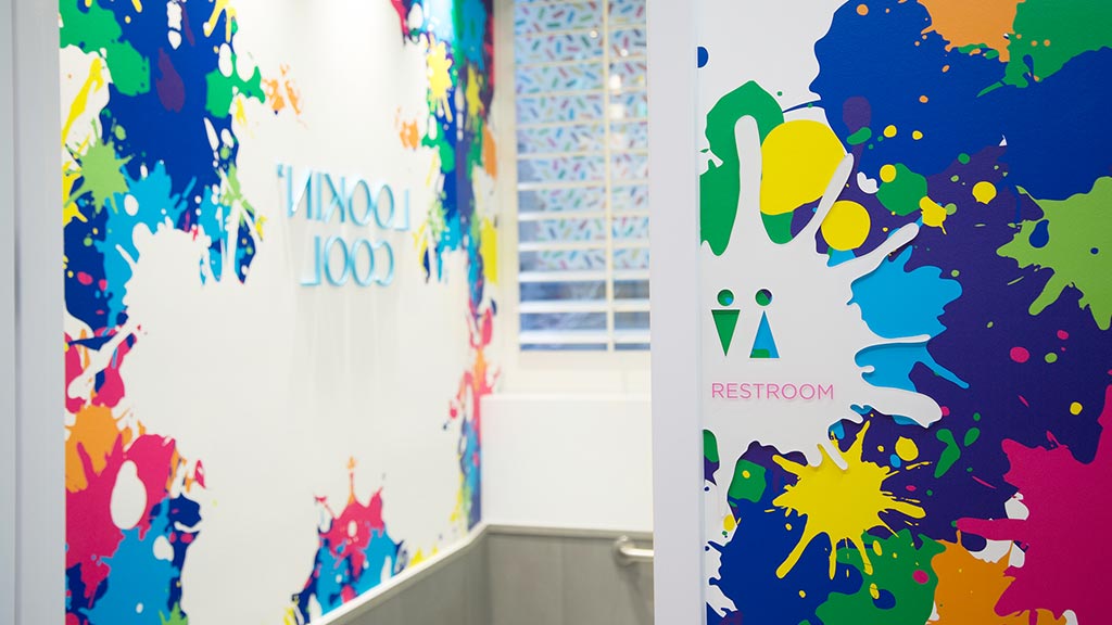 A wall with a painting on it.