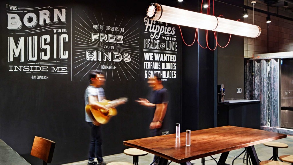 A man standing next to a table.