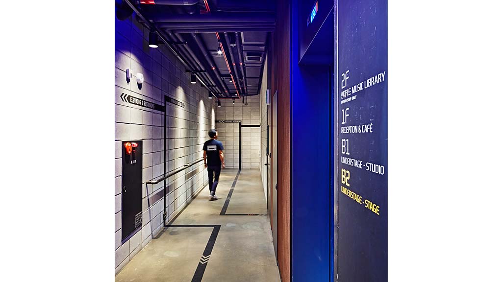 A person walking down a hallway.