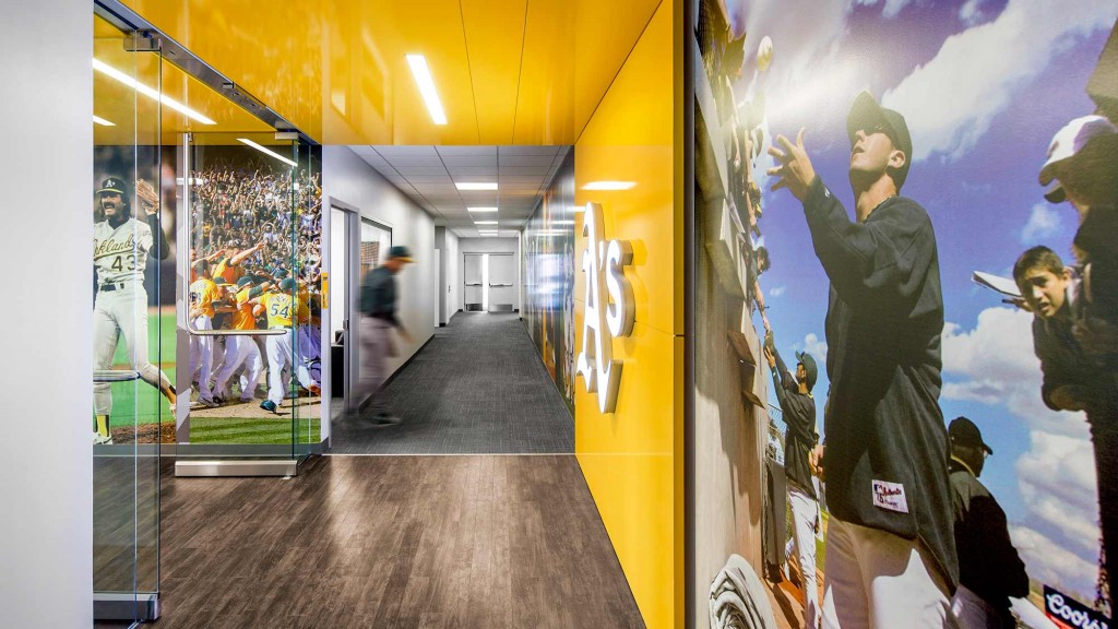 A hallway with a mural on the wall.