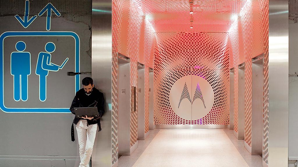 A person standing in a hallway.