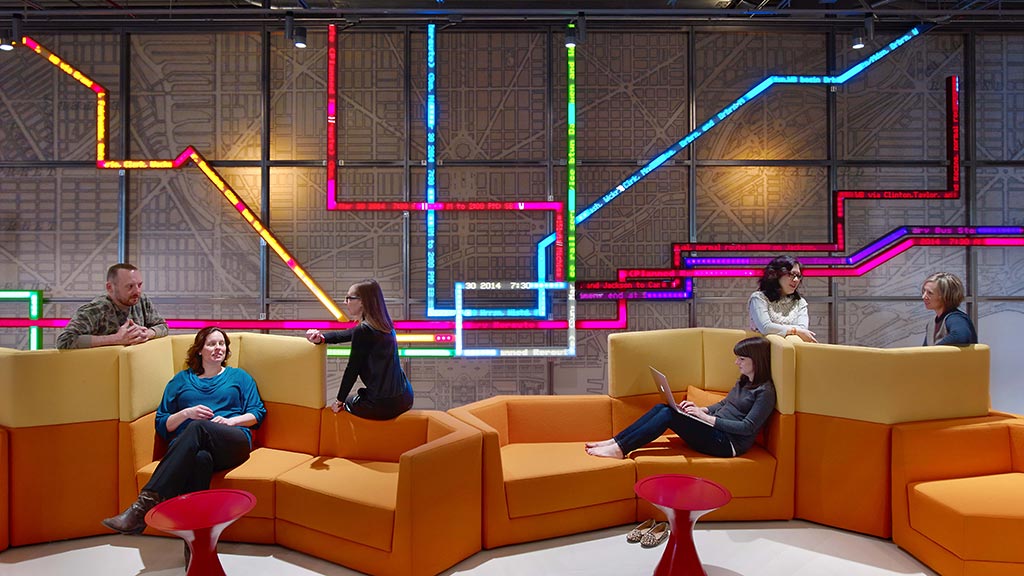 A group of people sitting on a couch.