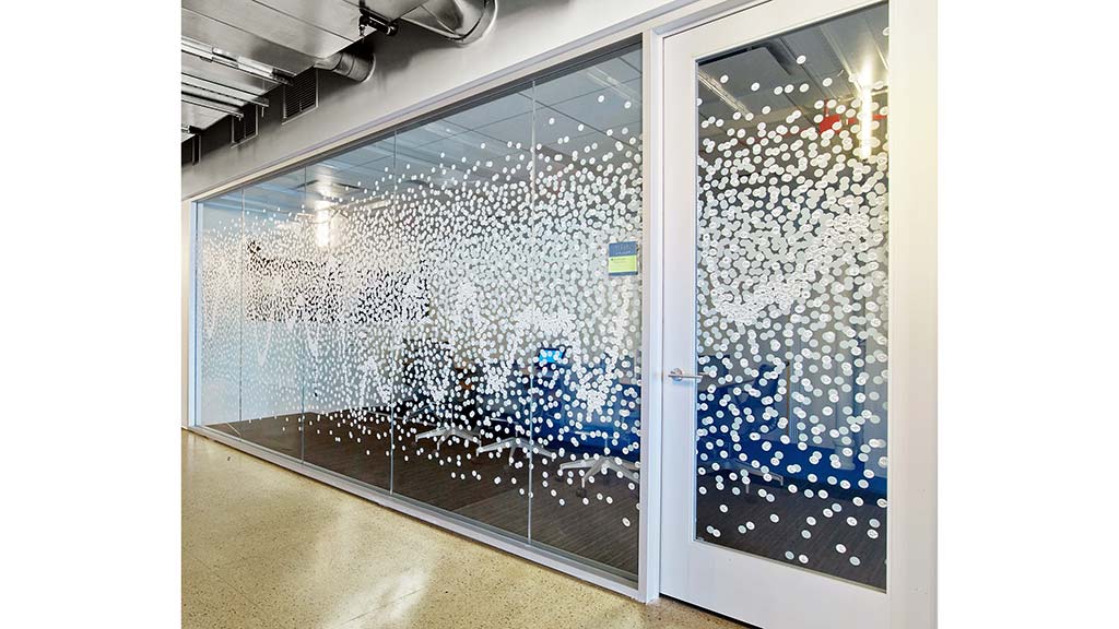 A glass door with a glass wall.