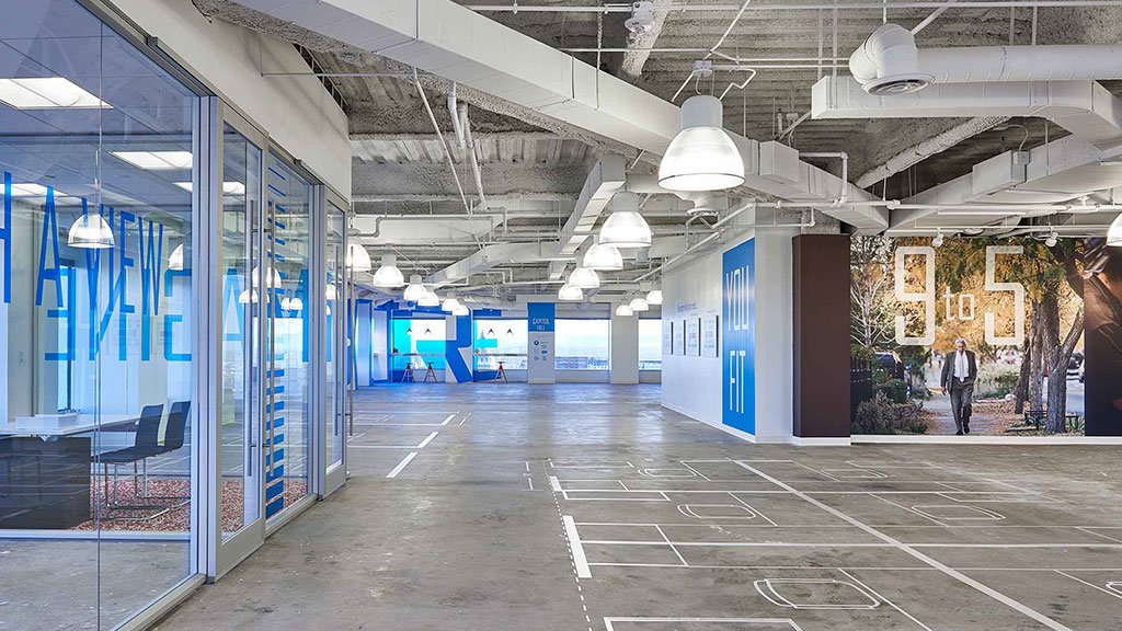 A large empty building with blue doors.