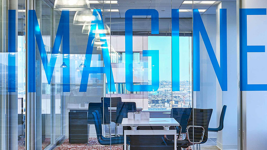 A room with a table and chairs.