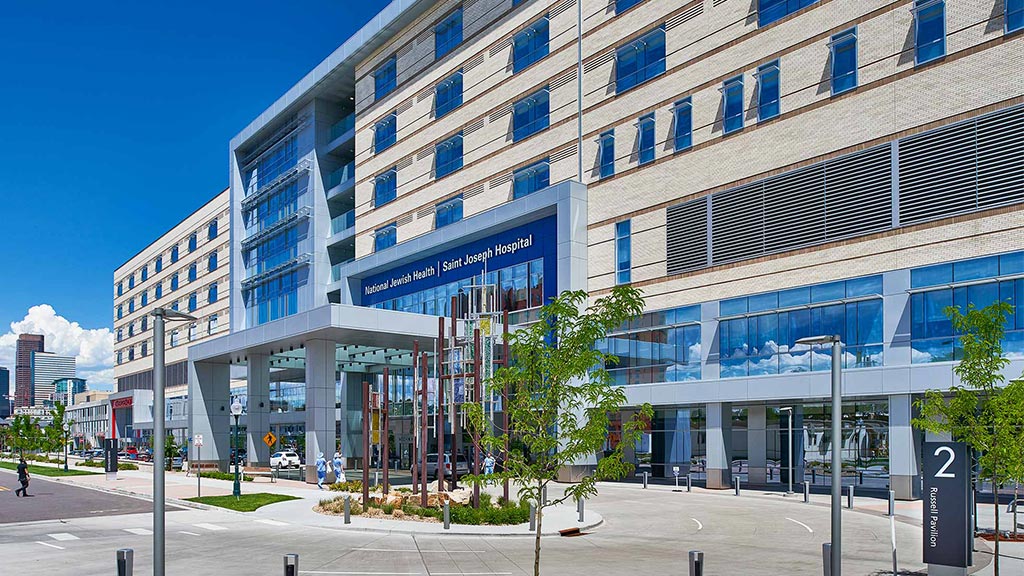 A building with a sign in front.