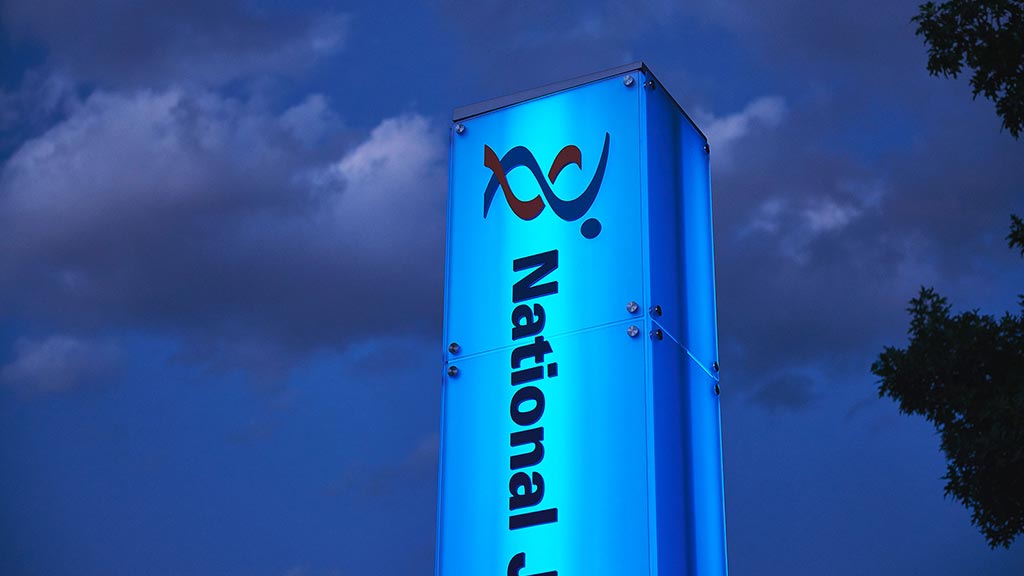 A blue sign with a cartoon on it.