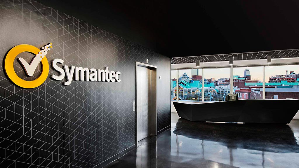 A large building with a sign on the wall.