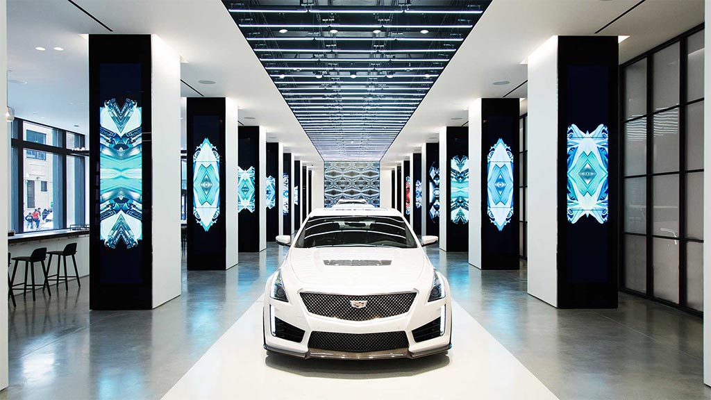 A white sports car in a showroom.