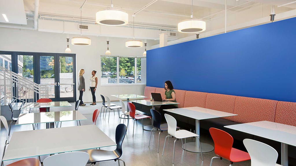 A room with tables and chairs.