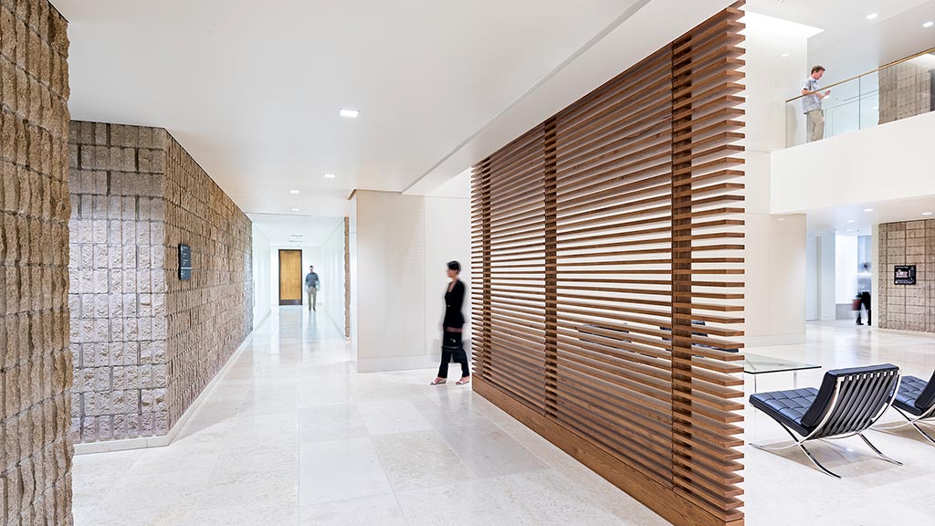 A person walking in a hallway.