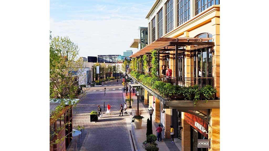 A street with people walking on it.