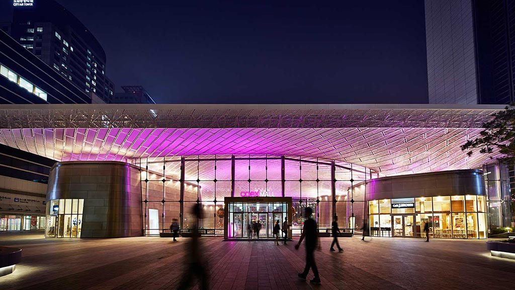 A building with a large glass front.