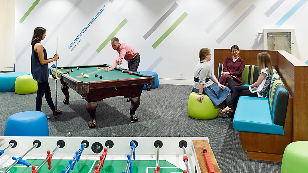 A group of people sitting around a table.
