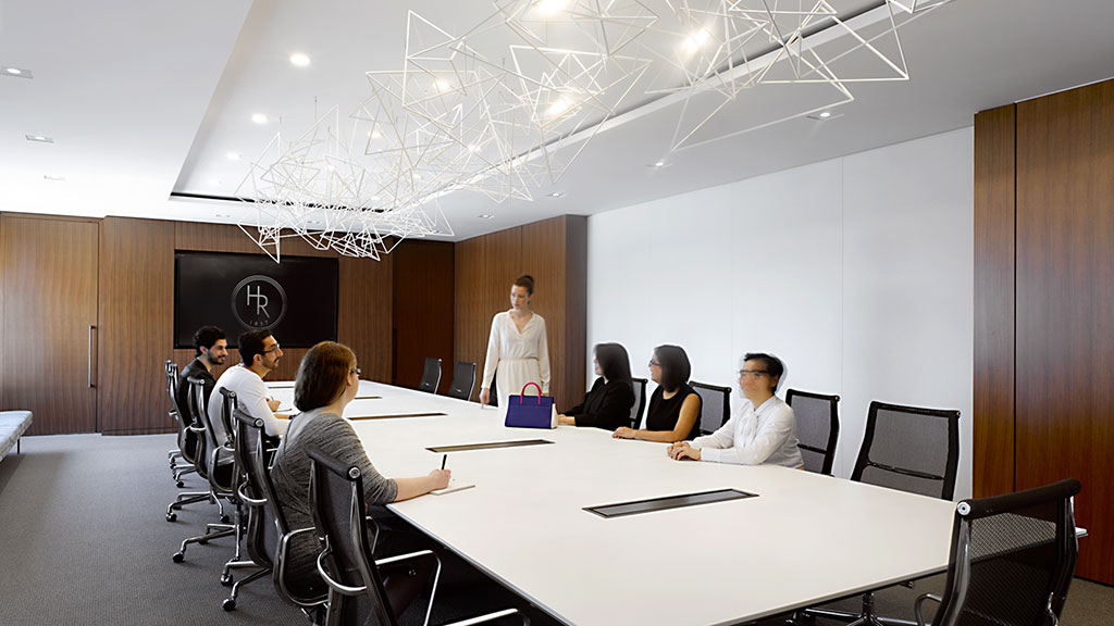 A group of people sitting around a table.