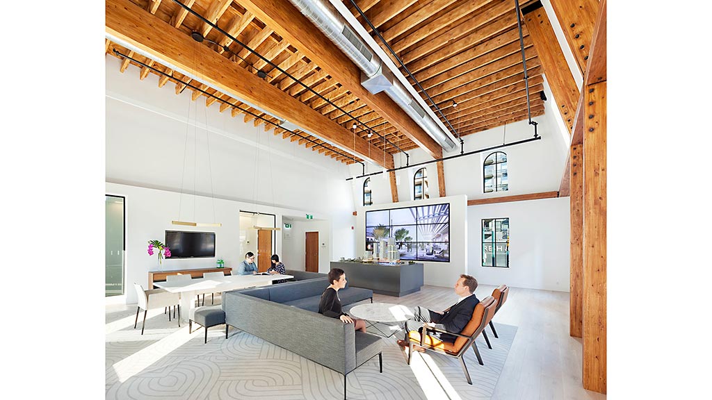 A person sitting on a couch in a living room.