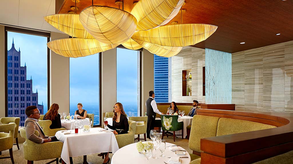 People sitting at tables in a room.