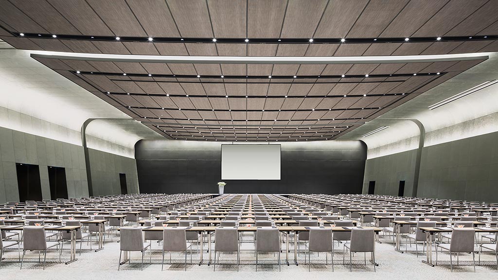 A room with a stage and chairs.