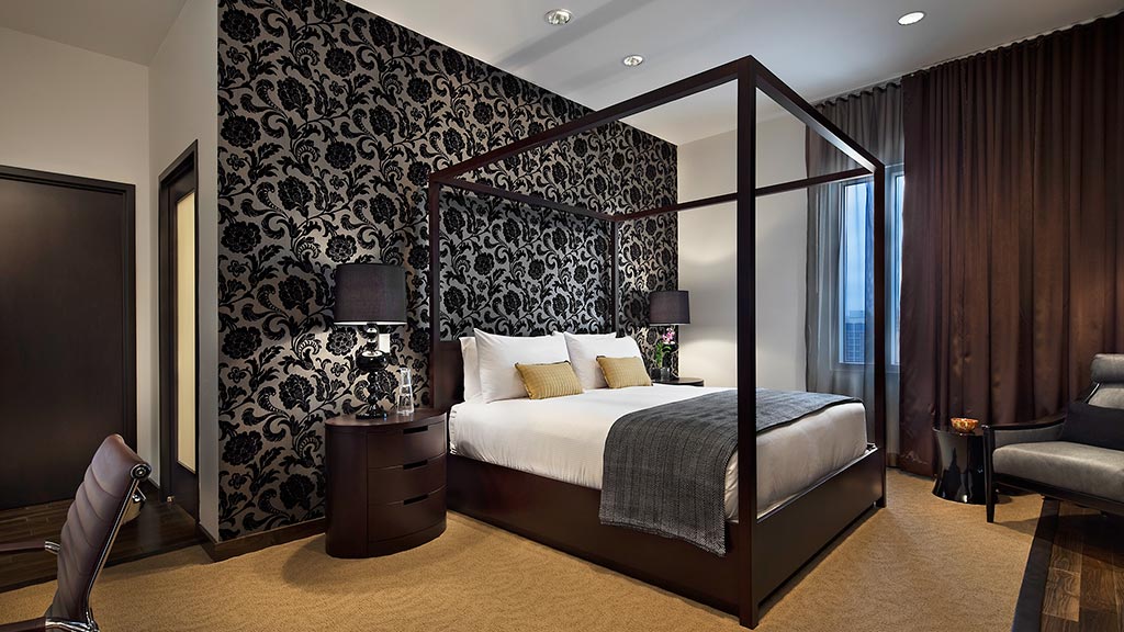 A bedroom with a large bed.